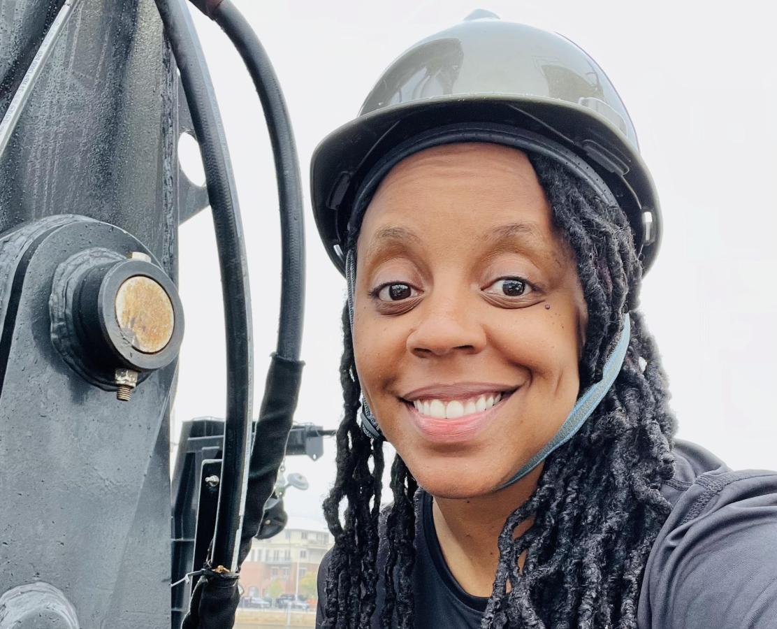 A woman in a hard hat aboard a NOAA ship