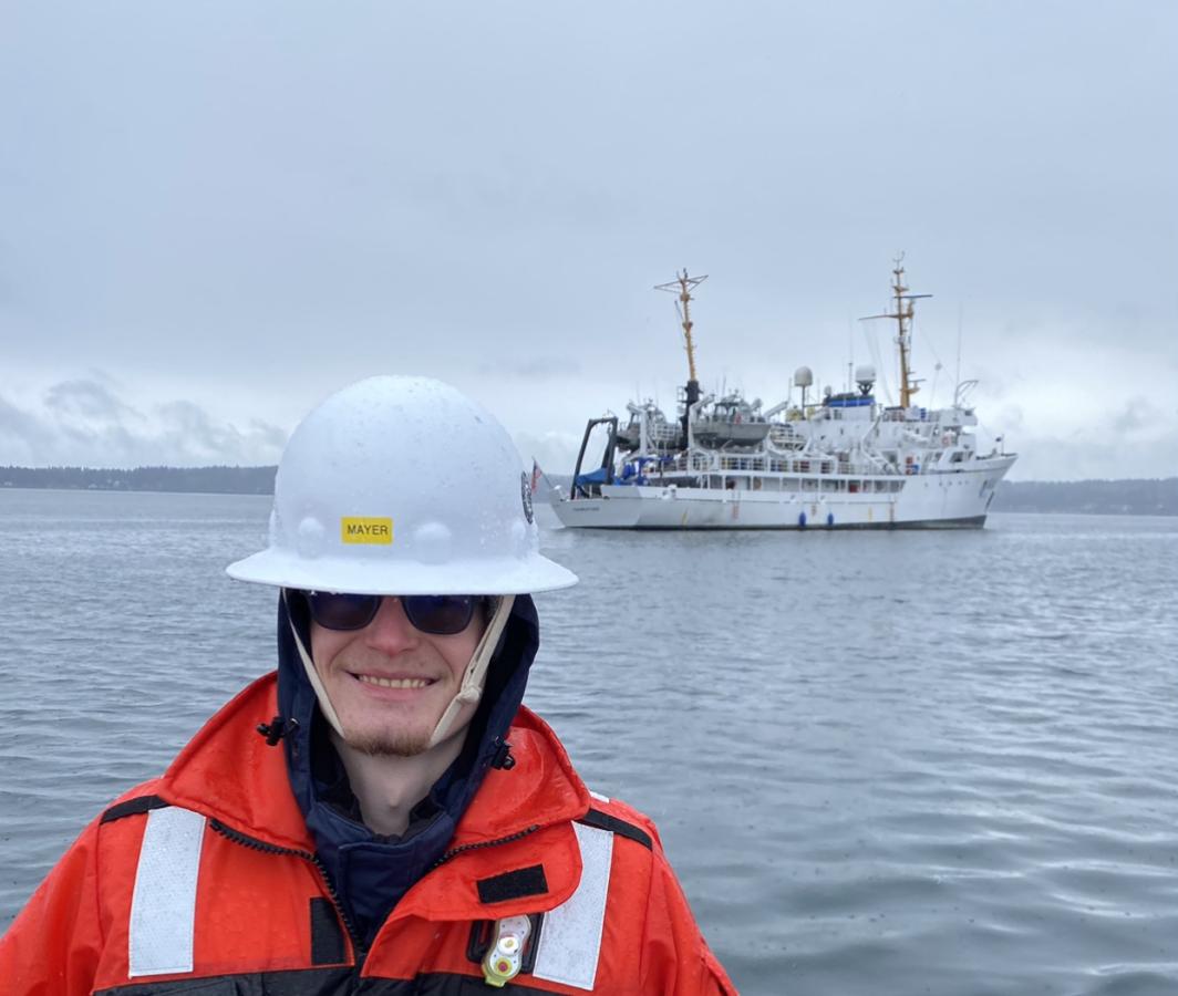 Garret Mayer with NOAA Ship Fairweather in the background. 