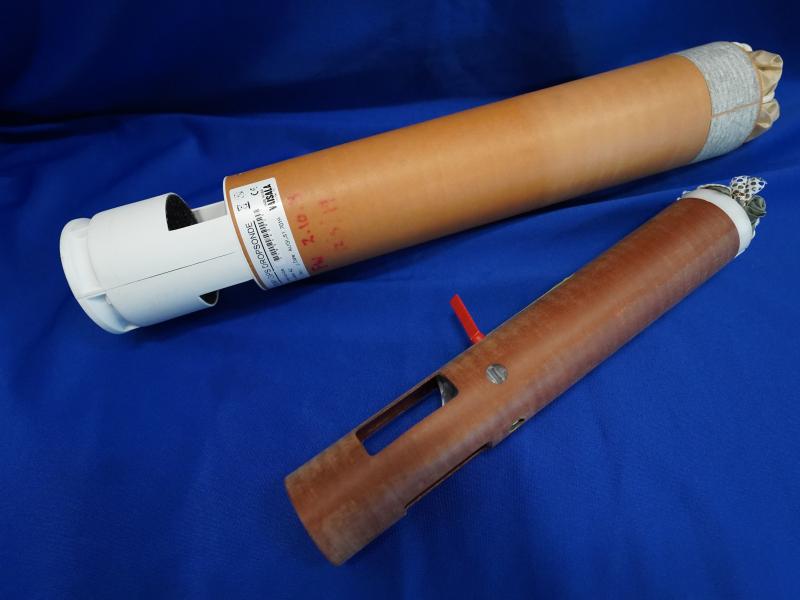 A large and small weather probe called a dropsonde