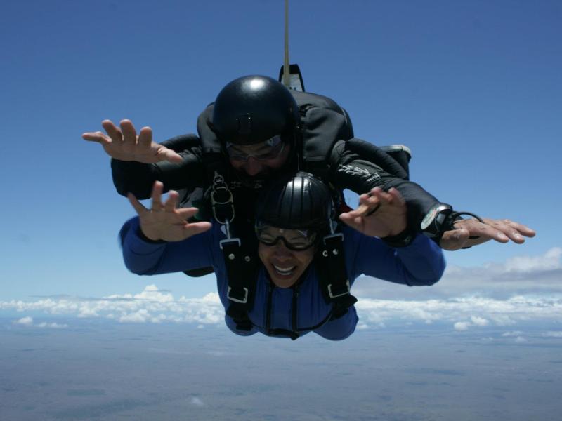 Two skydivers falling through the sky