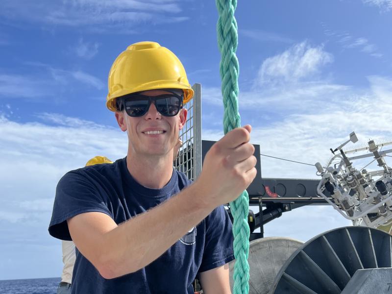 LTJG Tim Montera guiding a buoy line.