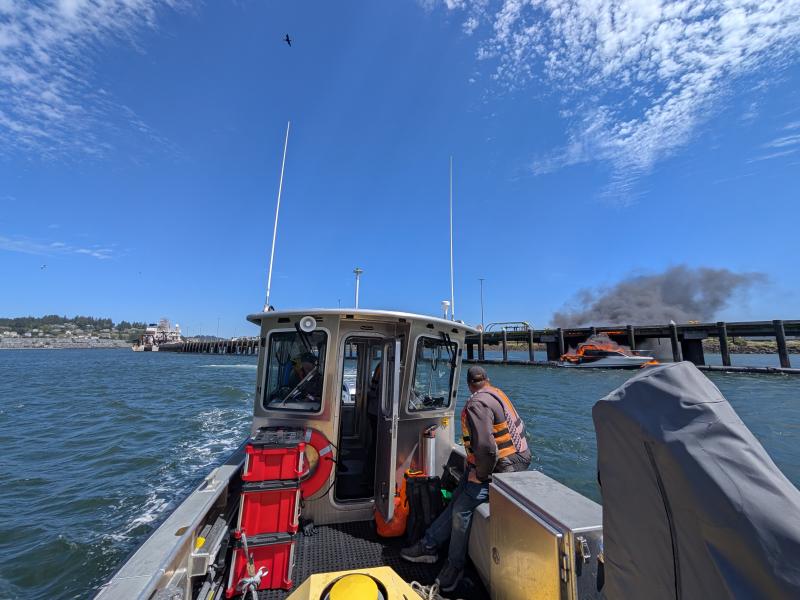 View from NOAA vessel of a boat on fire. Credit CDR Charles Wisotzkey