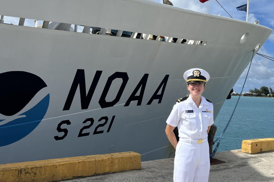 A NOAA Corps officer standing in front of NOAA Ship Rainier