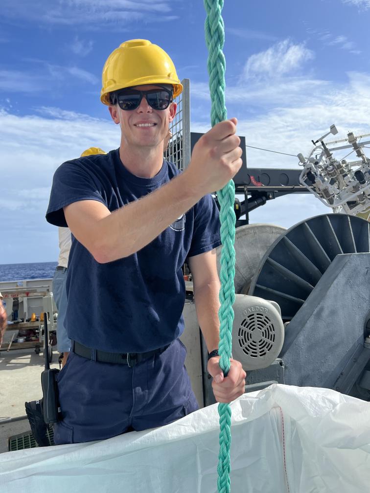 LTJG Tim Montera guiding a buoy line.