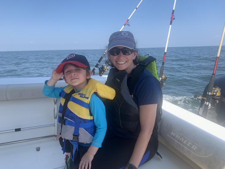 Alexis Gutierrez on a boat with her son. Credit: Alexis Gutierrez. 